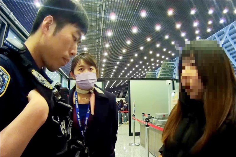 Aviation police stop a woman from falling into suspected honey trap at Taiwan Taoyuan International Airport Wednesday. Photo courtesy of the Aviation Police Bureau March 12, 2025