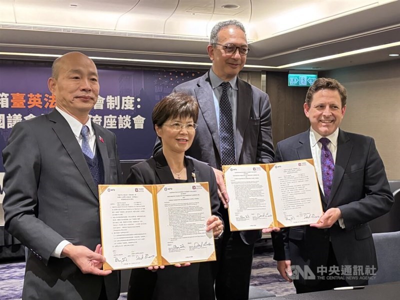 The Taiwan Foundation for Democracy (TFD) and the U.K.'s Westminster Foundation for Democracy (WFD) display a joint statement on Thursday promoting "smart parliament" initiatives. CNA photo March 13, 2025