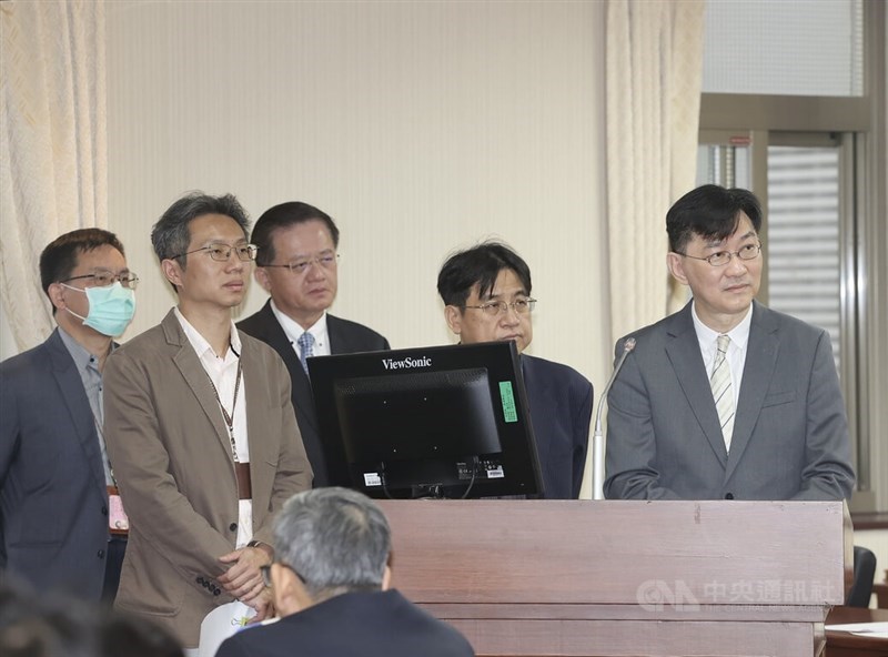 Deputy Interior Minister Dong Jian-hong (董建宏, right) speaks at a legislative session Thursday. March 13, 2025