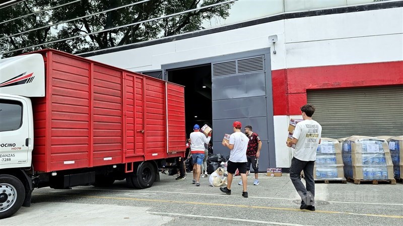 Volunteers load donations onto a truck at a stadium in Buenos Aires on Friday. CNA photo March 14, 2025