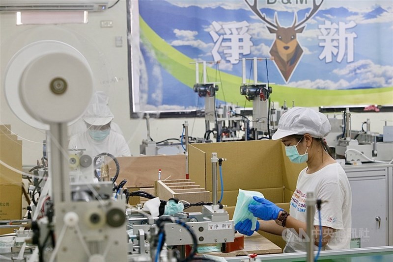 A worker mans a surgical mask production line. CNA file photo