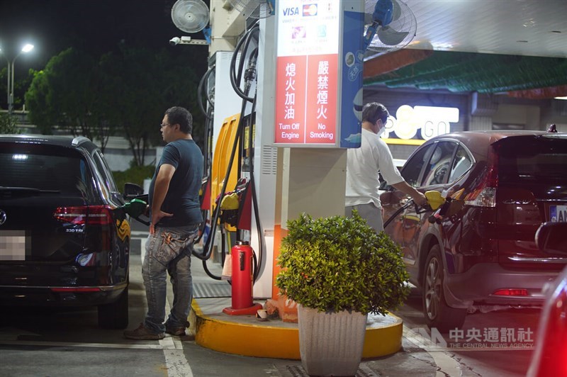 Car owners fill their cars up with petrol at a CPC gas station in this CNA file photo