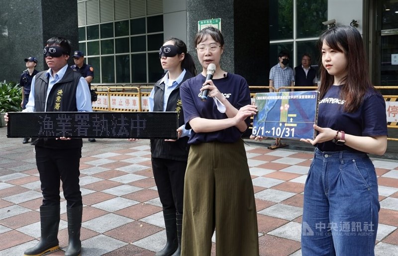 Huang Hsin-yi, marine project director at Greenpeace (front, second from right), joins protesters accusing Taiwan-flagged vessels of illegally catching sharks last year in a closed area of the North Pacific Ocean. CNA photo May 6, 2025