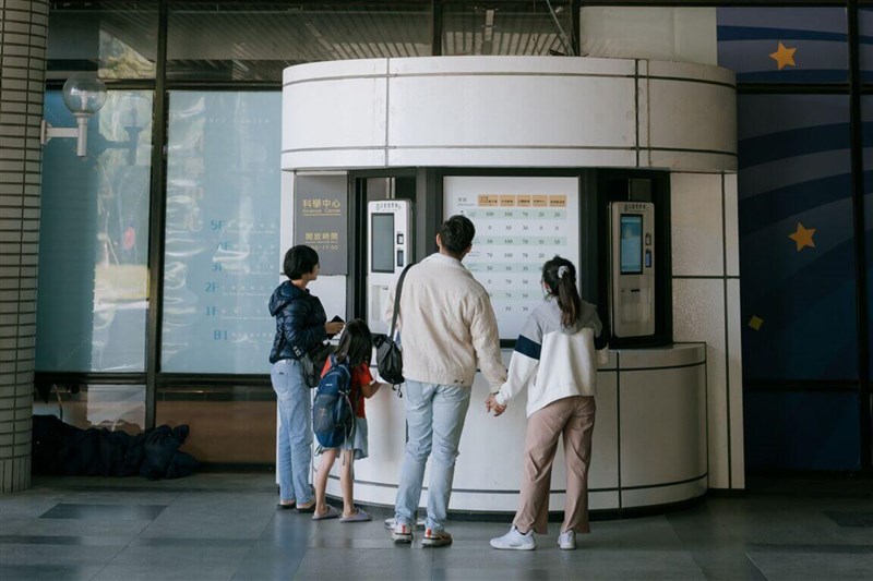 Visitors to Taichung's National Museum of Natural Science look at ticket prices to the museum. Photo courtesy of the National Museum of Natural Science