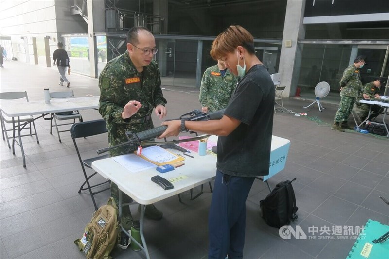 A reserve serviceman (in black t-shirt) undergoes an assessment to determine whether he remembers how to handle a T65K2 assault rifle. CNA photo June 7, 2025