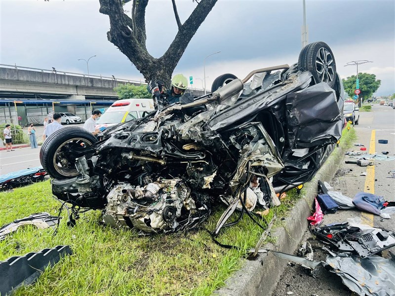 The heavily damaged vehicle lies overturned on a road divider. Photo courtesy of local police