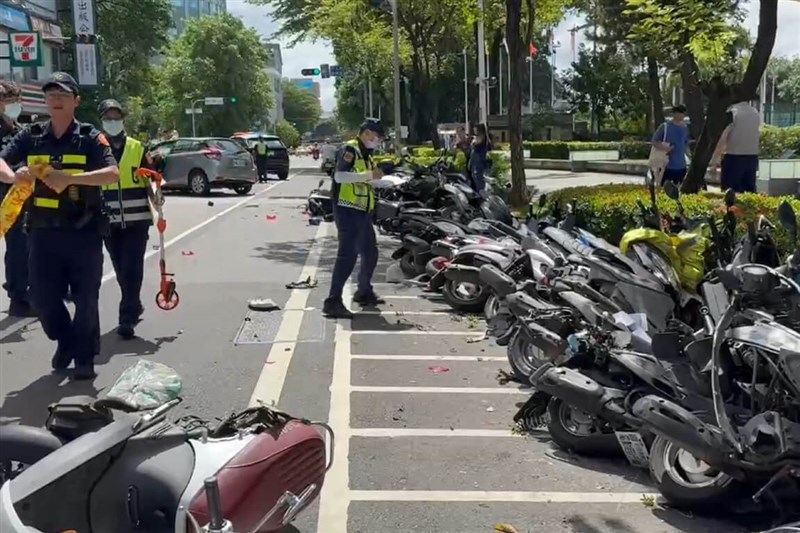 A row of parked scooters are knocked over after Liu hits them with her car during the Sunday accident. Photo courtesy of a local resident