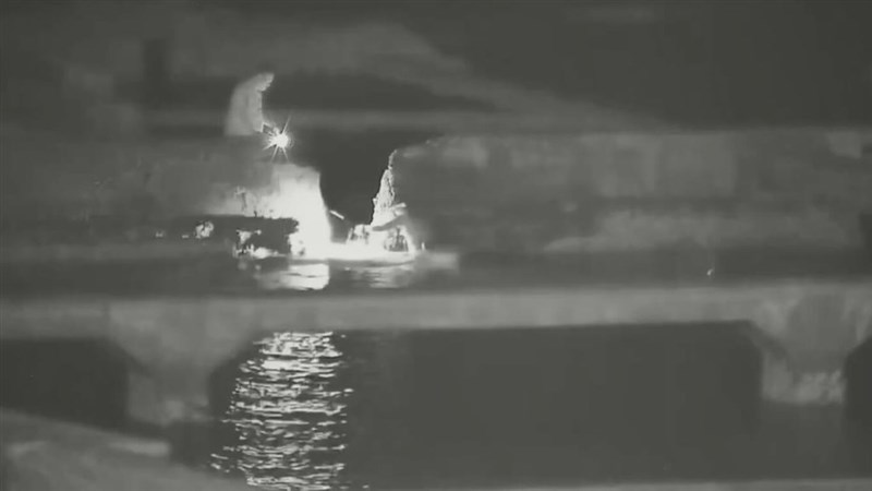 Security footage shows Lee and Hsu trespassing on a fish farm in New Taipei under the cover of darkness. Photo courtesy of a private contributor