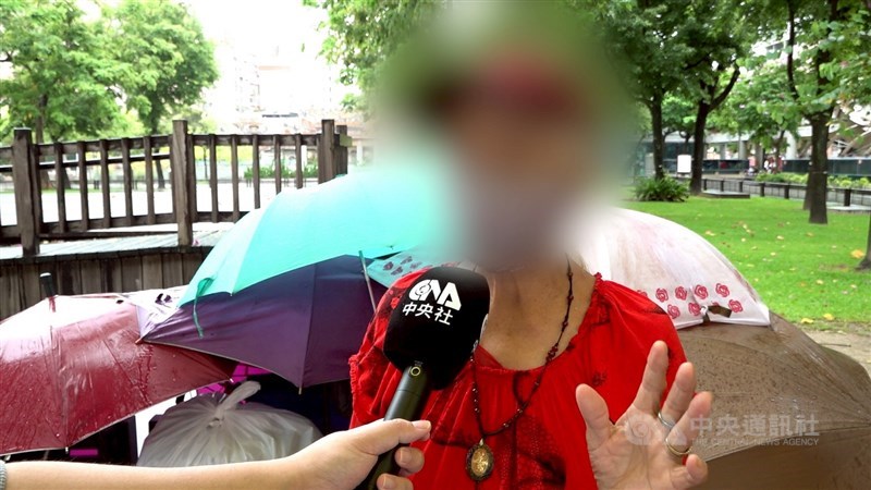 A homeless woman surnamed Wang explains why she will not move to a government-run shelter during an interview last Thursday. CNA photo June 19, 2025