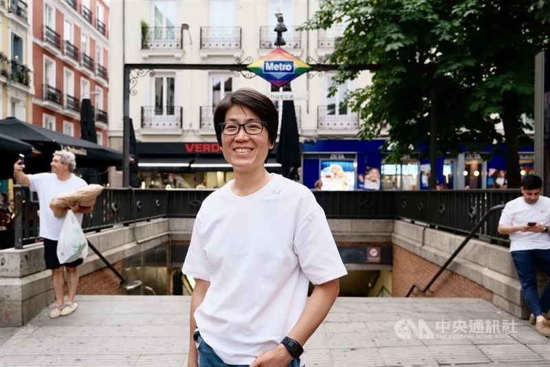 Hoho Liu poses in front of the Chueca metro station in Madrid. CNA photo June 25, 2025