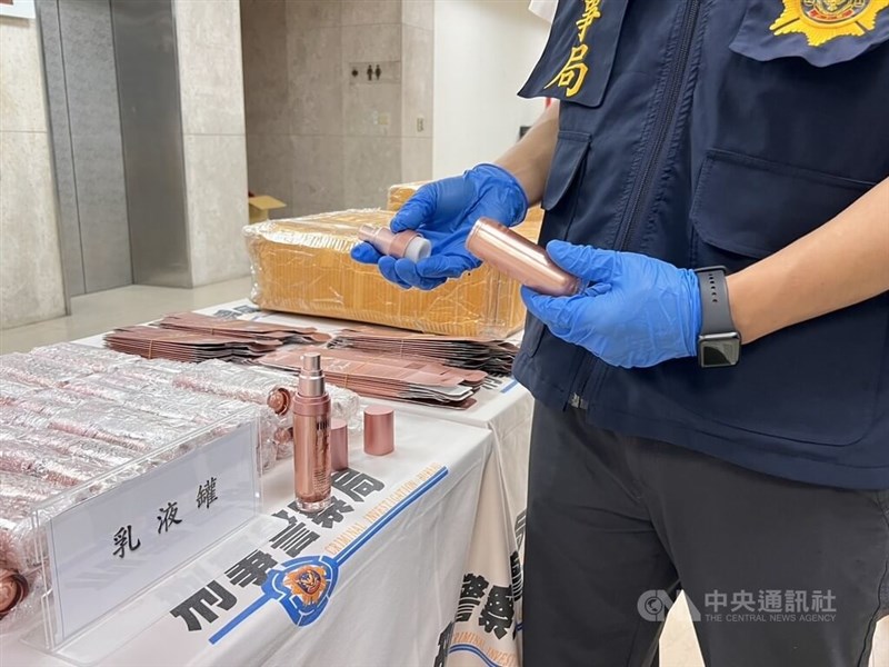 A Criminal Investigation Bureau official holds a bottle of skincare lotion containing hidden heroin. Photo courtesy of local authorities