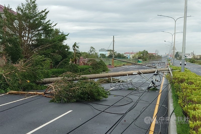 Electricity poles are seen toppled by Typhoon Danas along the side of a road in Tainan on Monday. CNA photo July 7, 2025