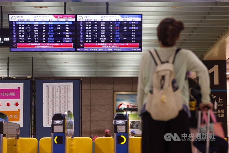 A passenger looks at the train schedule at Taipei Main Station. CNA photo, CNA photo July 7, 2025