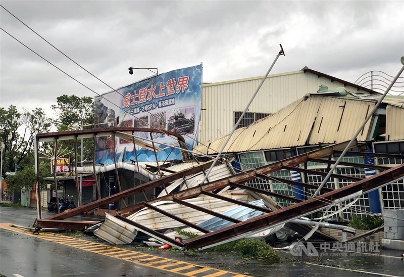 A large shop sign in Chiayi is seen collapsed onto the road in the aftermath of Typhoon Danas. CNA file photo July 7, 2025