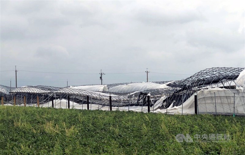 Shade nets covering greenhouses in Chiayi County appear distorted Tuesday. CNA photo July 8, 2025