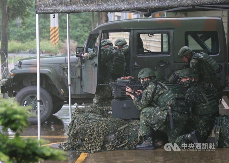 Army reservists simulate defending a logistics supply site under attack by Chinese operatives during Friday’s drill in Taoyuan. CNA photo July 11, 2025
