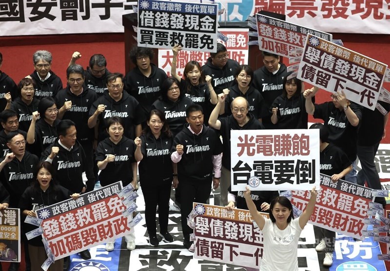 DPP lawmakers hold banners in the Legislature in Taipei on Friday. CNA photo July 11, 2025