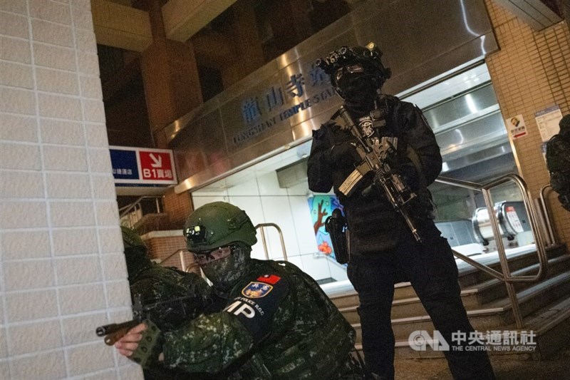 Two soldiers stand guard outside a MRT station in Taipei. CNA photo July 14, 2025