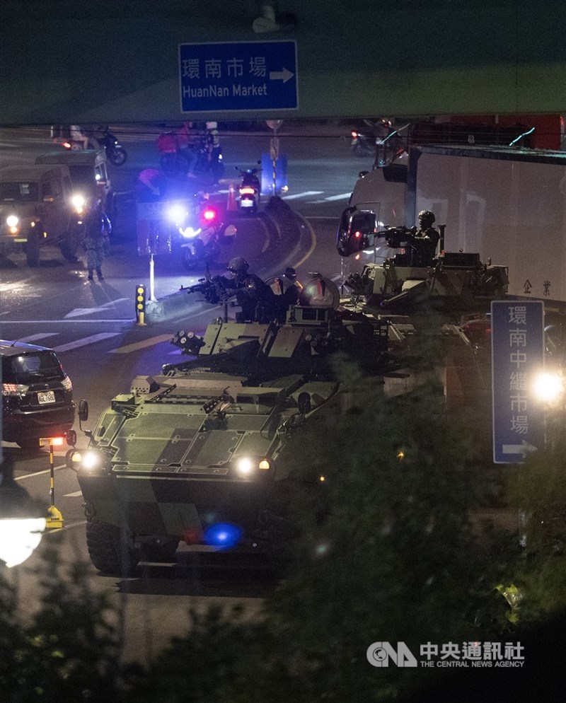 Members of the Military Police stand guard with an armored vehicle. CNA photo July 15, 2025