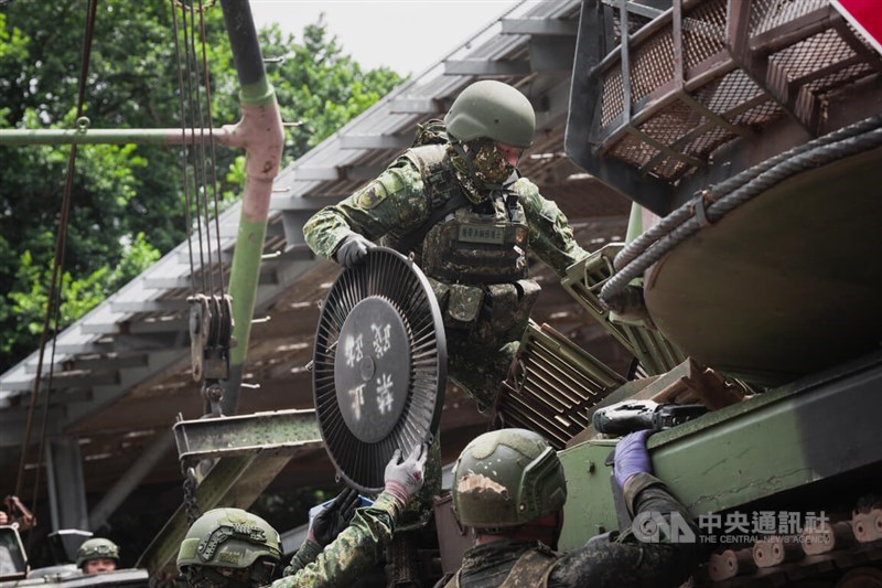 Several personnel from the Longtan Combined Maintenance Depot under the 3rd Regional Support Command repair a CM11 tank by replacing a fan in the engine compartment in Taoyuan on Wednesday. CNA photo July 16, 2025