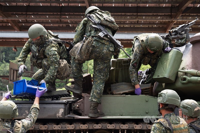 Several personnel from the Longtan Combined Maintenance Depot under the 3rd Regional Support Command repairs CM11 tank by replacing a fan in the engine compartment in Taoyuan on Wednesday. CNA photo July 16, 2025