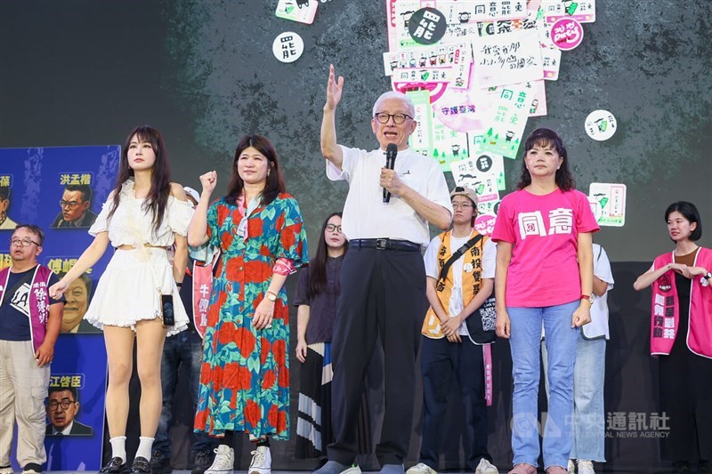 UMC founder and recall campaigner Robert Tsao (front, center right) speaks at a rally in Taipei Saturday. CNA photo July 26, 2025