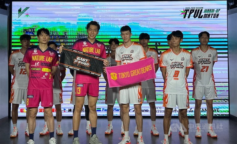 Members of the Taipei East Power volleyball team (in white) pose together with representatives of Japan's Tokyo Great Bears (in pink), the visiting guest volleyball team who will play against Taiwan's teams in a number of exhibition games in September. CNA photo Aug. 1, 2025