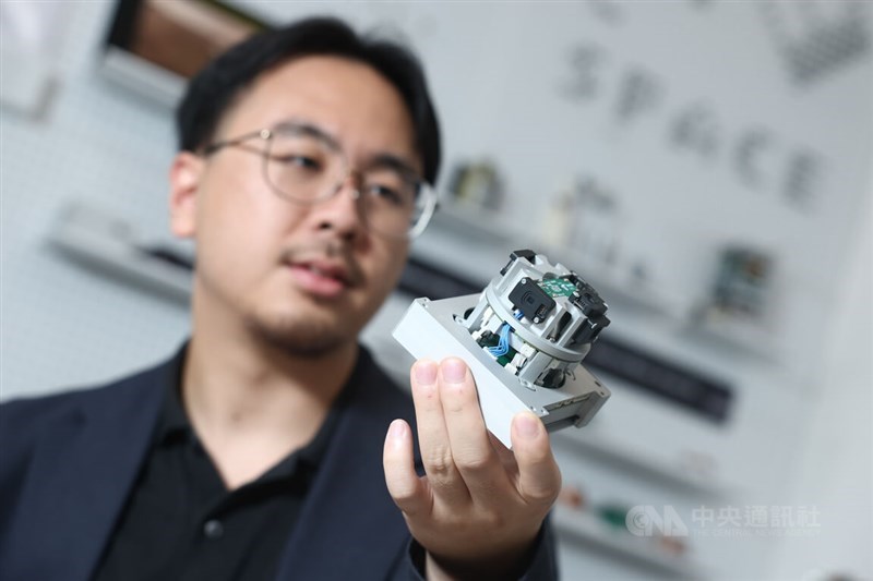 Thomas Yen holds up a spherical motor. CNA photo July 20, 2025