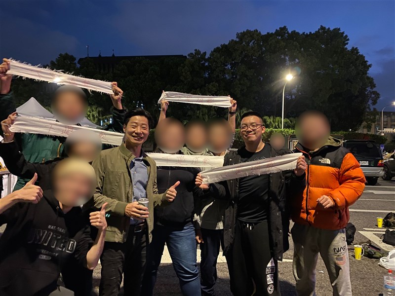 Ivan Choi (second right) and his friends smile for a photo with Taiwanese politician Freddy Lim (fourth left) while attending a Taipei music festival commemorating the 228 Incident on Feb. 28, 2023. Photo courtesy of Ivan Choi Aug. 22, 2025