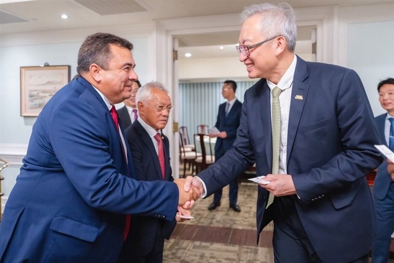 Teva Rohfritsch (left), a French Polynesian senator, shakes hands with Deputy Foreign Minister François Wu. Photo courtesy of the Ministry of Foreign Affairs Aug. 26, 2025