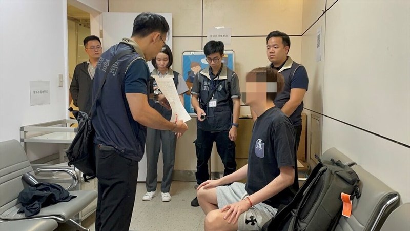 The suspect, surnamed Liu (face blurred), is seen being arrested by investigators during a recent raid. Photo courtesy of the Investigation Bureau