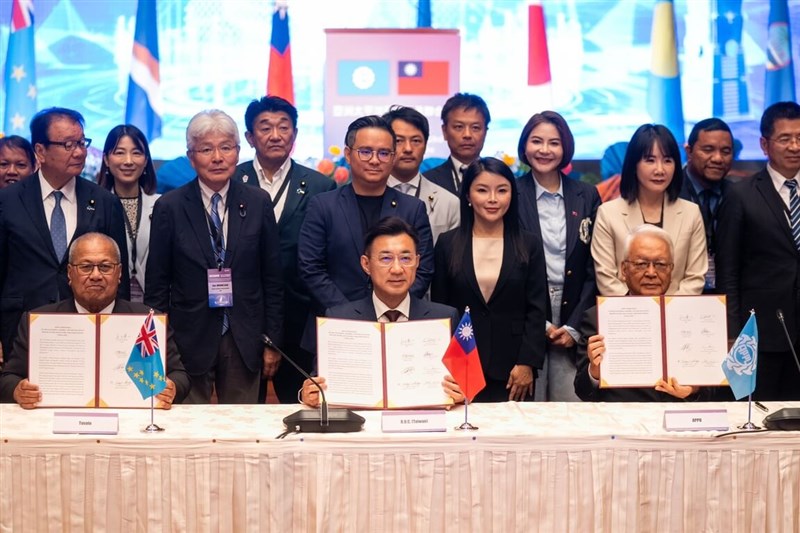 Deputy Legislative Speaker Johnny Chiang (center) signs a joint communique at the closing of the Asian-Pacific Parliamentarians' Union General Assembly in Taipei on Friday. Photo courtesy of the Legislative Yuan Aug. 29, 2025