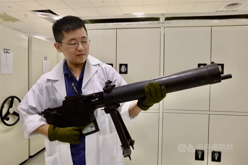 A museum staff displays a Maschinengewehr 08 heavy machine gun used in WWII inside the under construction-museum. CNA photo Sept. 14, 2025