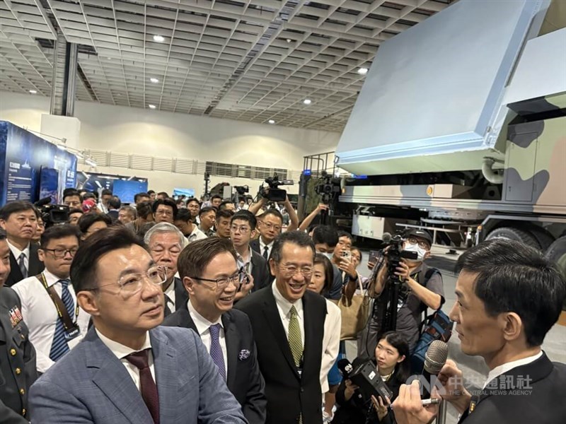 Defense Minister Wellington Koo (third from left, front) and lawmaker Johnny Chiang (front left), along with other guests, listen to Lu Chien-sheng, deputy head of the Sky Bow program, introduce the Tien Kung III surface-to-air missile system in Taipei on Thursday. CNA photo Sept. 18, 2025.