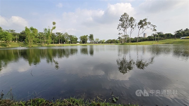 The silhouette of the blue sky and greens cast upon the Cheng Ching lake in Kaoshiung's Green Park on Thursday. CNA photo Oct. 9, 2025