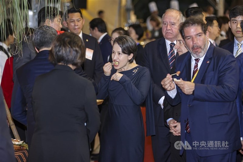 Vice President Hsiao Bi-khim (front center) enjoys Taiwanese cuisine at National Day reception in Taipei on Friday. CNA photo Oct. 10, 2025