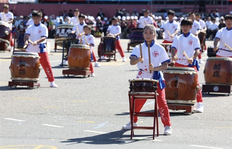 Young performers of the Taiwan Taiko Association perform in front of the Presidential Office on Friday as a part of a 100 drummer performance to open Taiwan's National Day celebrations. CNA photo Oct. 10, 2025