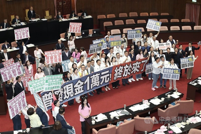 Lawmakers held banners inside the Legislative Yuan in Taipei on Friday. CNA photo Oct. 17, 2025