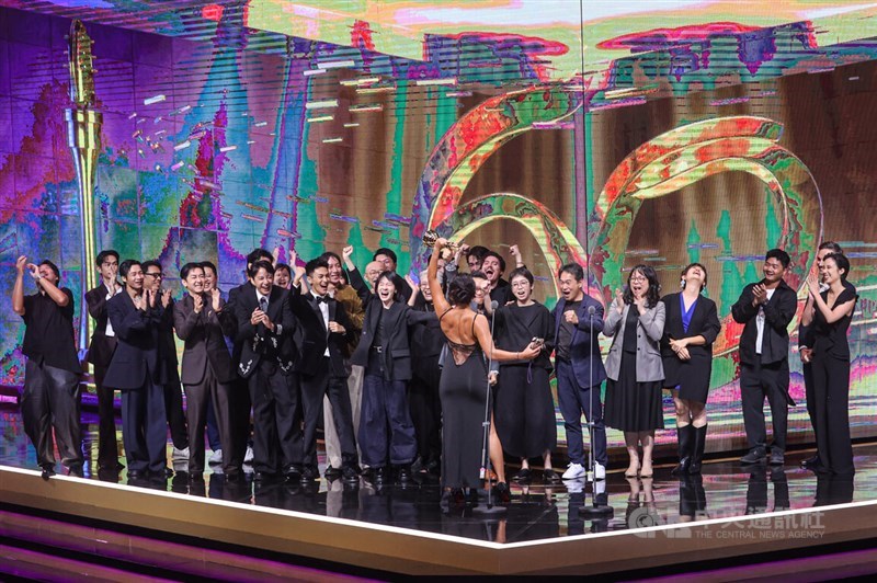 The cast and crew of the historical miniseries "Three Tears in Borneo" rock the stage as they cheer in Taipei on Saturday. CNA photo Oct. 18, 2025