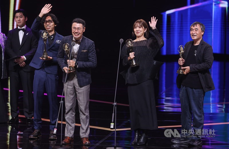 The art and design crew of "Black Tide Island" waves to the audience after winning the Best Art and Design award in Taipei on Saturday. CNA photo Oct. 18, 2025