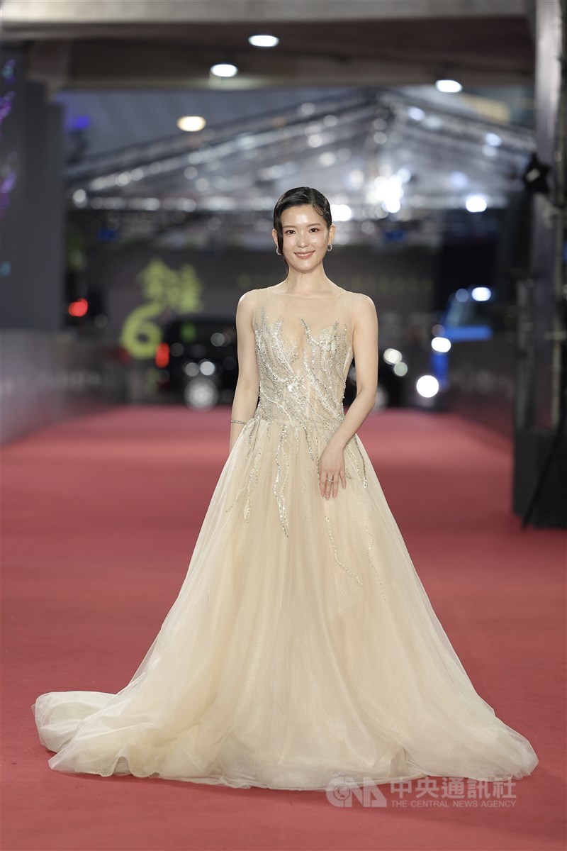 Mu Mei, an actress in Black Tide Island, makes a grand entrance on the red carpet in a maize gown in Taipei on Saturday. CNA photo Oct. 18, 2025
