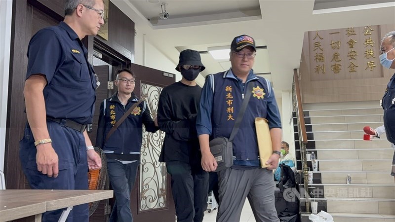 New Taipei police take actor Chen Bo-lin (in black) into custody in New Taipei on Saturday. CNA photo Oct. 21, 2025