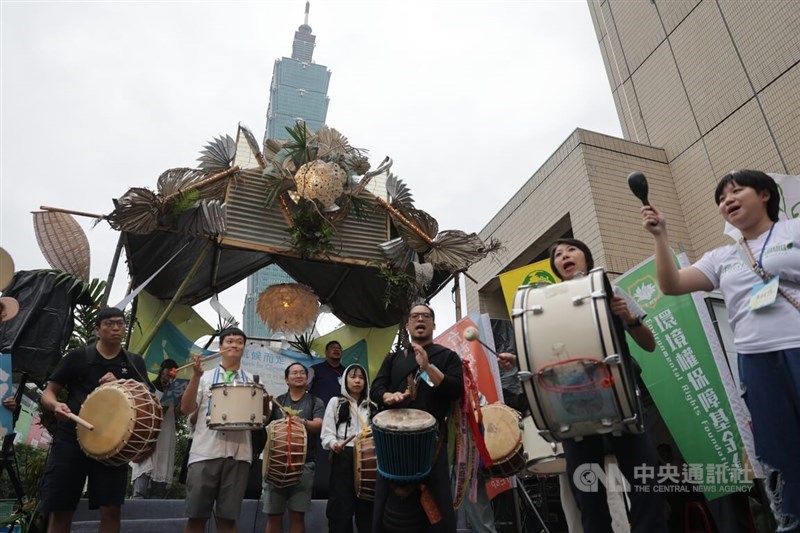 Multiple civic groups lead a march, striking Batuca drums to raise public awareness for environmental protection in Xinyi, Taipei, on Saturday. CNA photo Nov. 1, 2025