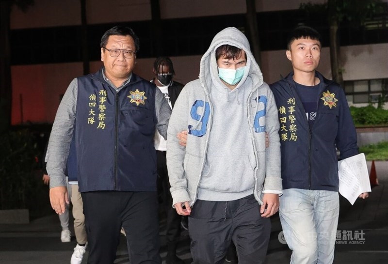 Former SBL player Ko Min-hao (center) is arrested by law enforcement officers for questioning over game-fixing and gambling. CNA file photo