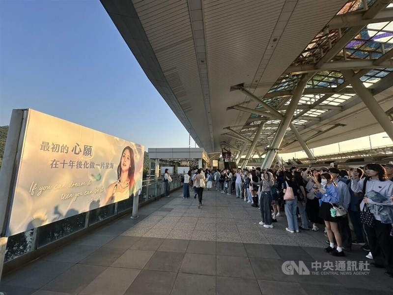 Countless fans of K-pop group TWICE take pictures of a poster celebrating the group's Taiwanese member Chou Tzu-yu, after flooding the Kaohsiung National Stadium on Saturday for the first day of the group's two-day concert. CNA photo Nov. 22, 2025