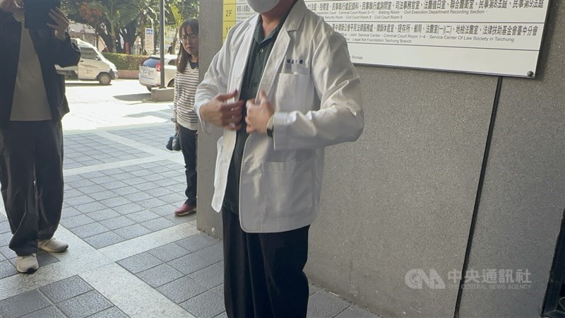 Chen's father appears in his son's shirt, pants and internship white coat during Tuesday's hearing in Taichung. CNA photo Dec. 9, 2025