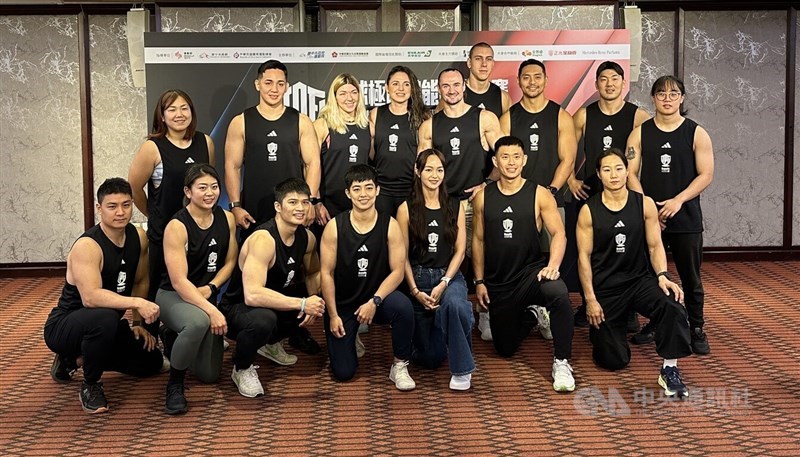 Participants of the 2025 Power Fitness Grand Prix pose for a photo on a Friday news conference in Taichung ahead of the weekend competition. CNA photo Dec. 12, 2025