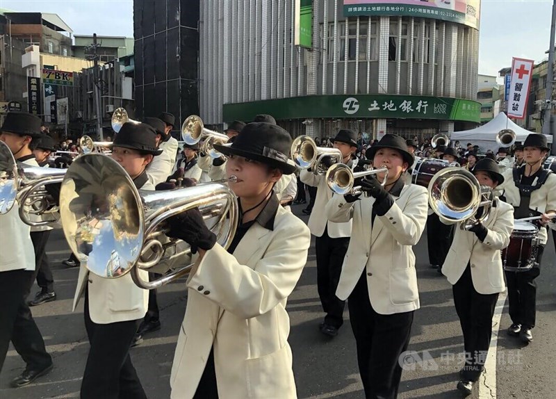Dressed to a tee, students from Japan's Kumamoto Technical High School Wind Orchestra march down Zhongshan Road in Chiayi City on Saturday. CNA photo Dec. 20, 2025