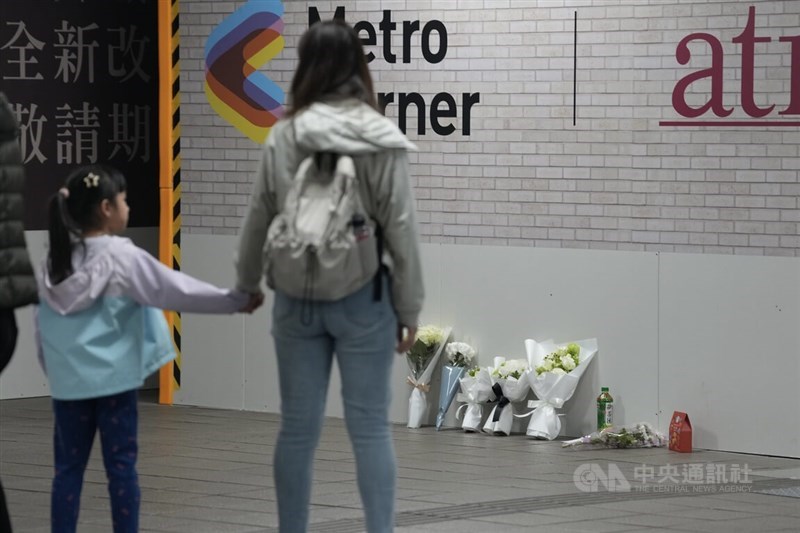Flowers are seen near Exit M8 at MRT Taipei Main Station on Saturday following deadly attacks at the station and near neighboring MRT Zhongshan Station the previous night. CNA photo Dec. 20, 2025