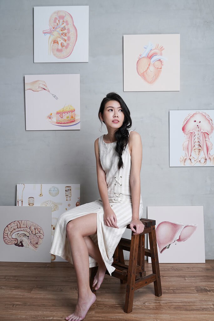 Taiwanese artist Emma Cheng poses with her illustrations. Image courtesy of Emma Cheng Dec. 20, 2025